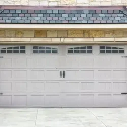Carriage-house-style-steel-garage-door.webp